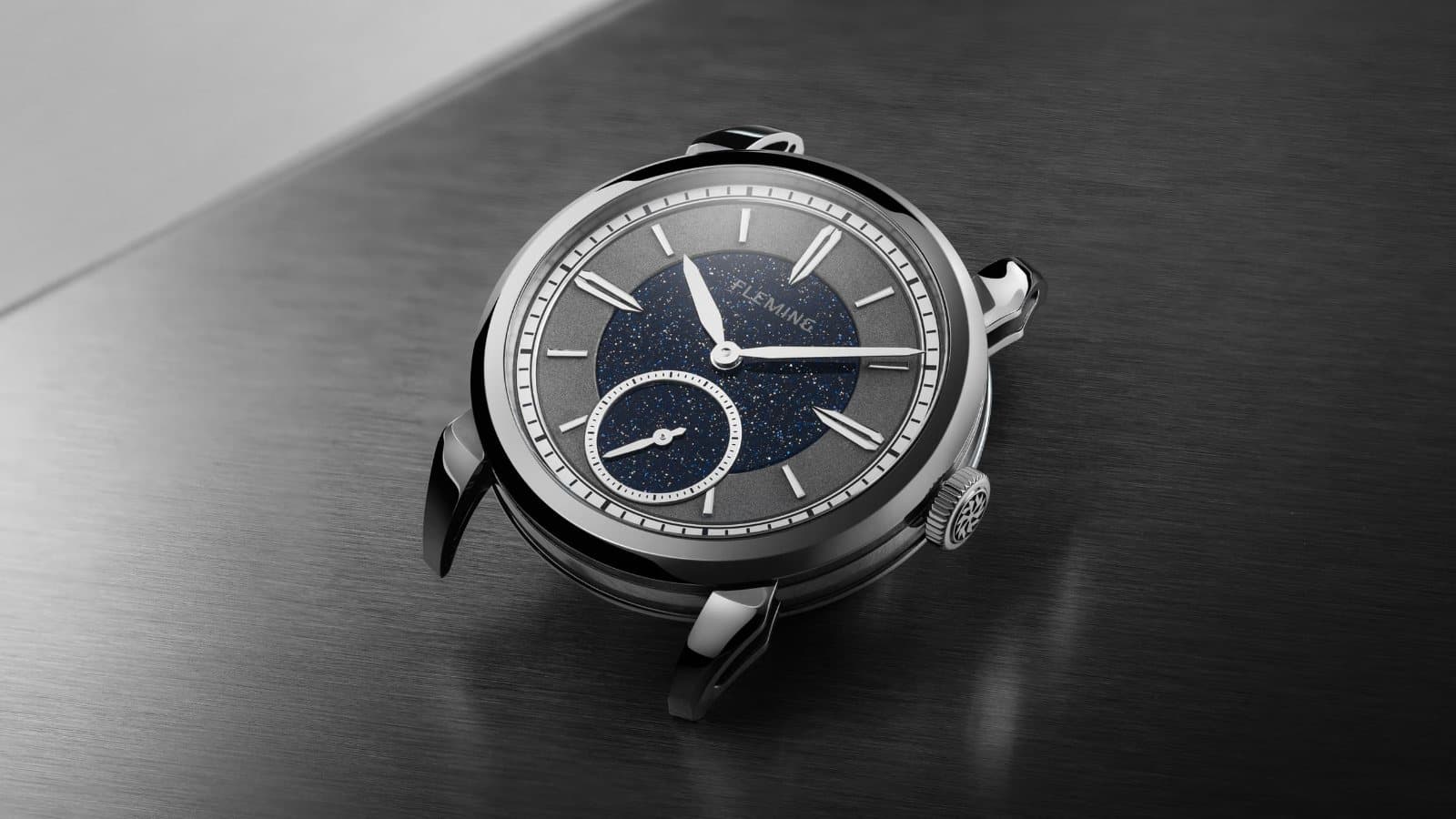 Fleming launch-edition watch with a blue aventurine dial and small seconds, lying on brushed steel